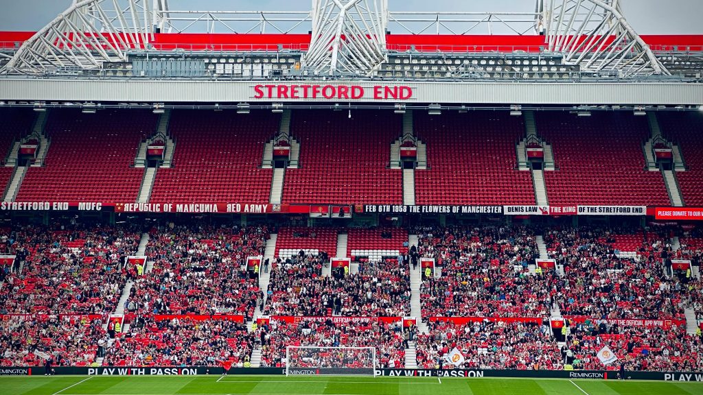 View of the Stretford End crowd at Manchester's iconic stadium during a day event.